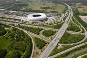 Luftaufnahme von München mit der Allianz Arena und umliegenden Verkehrsanbindungen – wirtschaftliches Zentrum im Immobilienmarkt in München